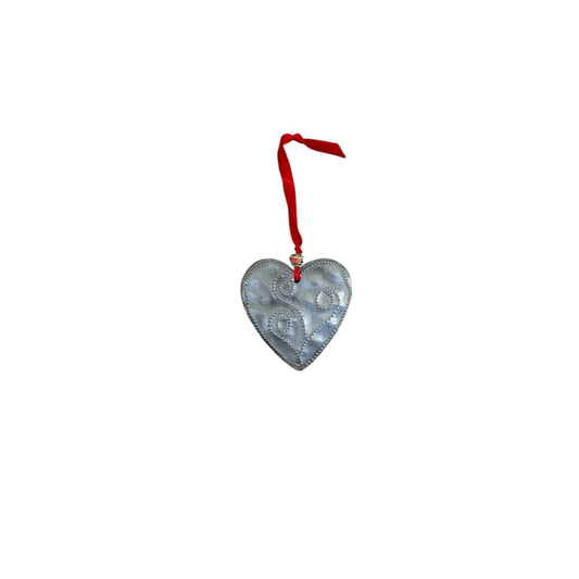 Handcrafted metal heart ornament with swirl design, red ribbon hanger, Haitian artisan decor