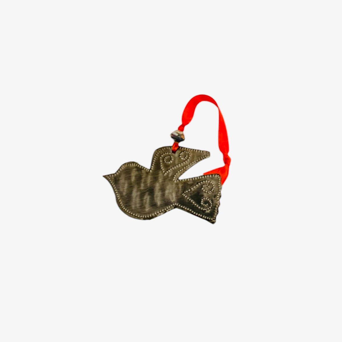 Handcrafted metal dove ornament with red ribbon, featuring Haitian artisan designs and cultural motifs.