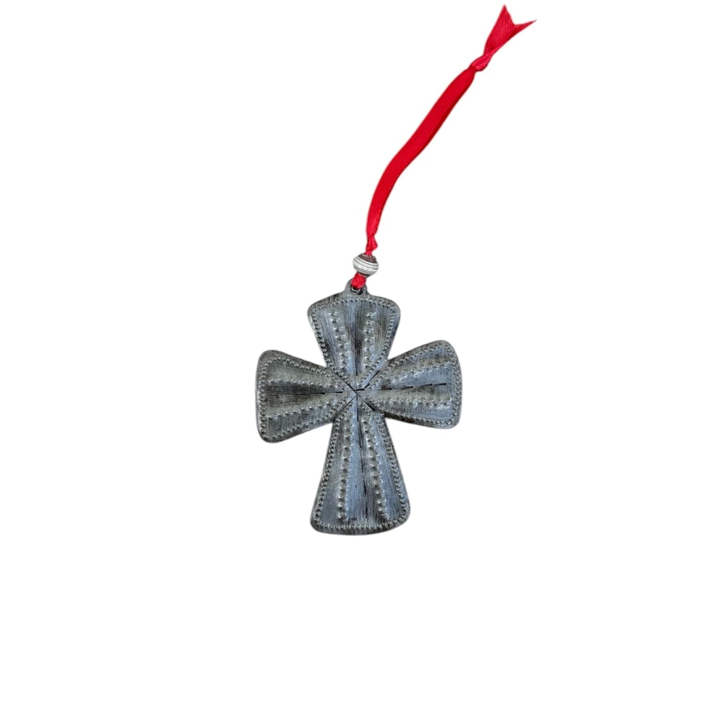 Handcrafted metal cross ornament with red ribbon, showcasing Haitian artisan craftsmanship and cultural artistry.