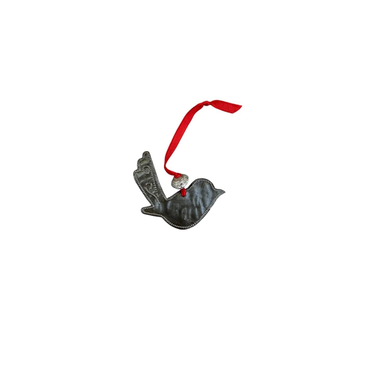 Handmade metal dove ornament with red ribbon, celebrating Haitian artisan artistry and cultural resilience.