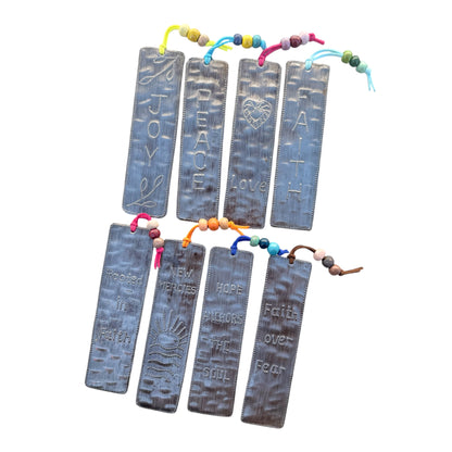 Back view of handcrafted Haitian steel affirmation bookmark with colorful beaded tassel