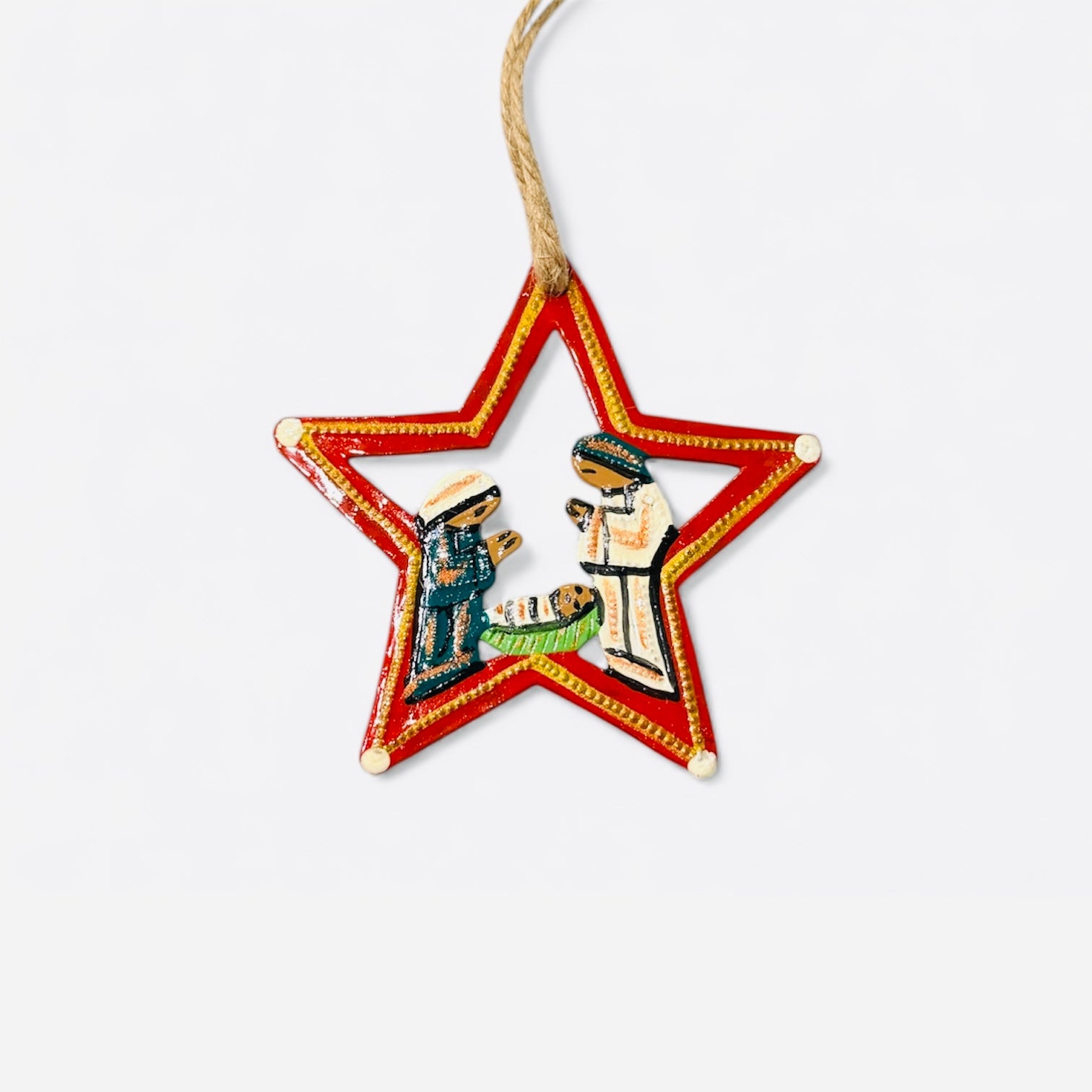 Star-shaped Christmas ornament with a Nativity scene of the Holy Family.