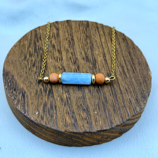 Handmade Terra Bloom essential oil diffuser necklace with authentic Haitian clay beads and gold-plated stainless steel chain